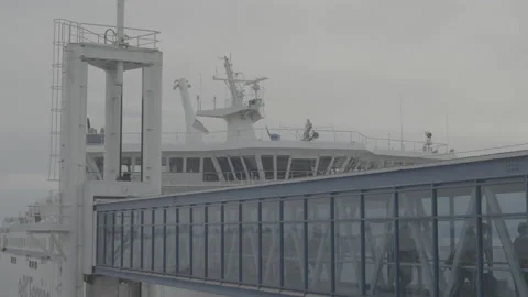 Passengers leaving ferry through bridge Video stock 199145189