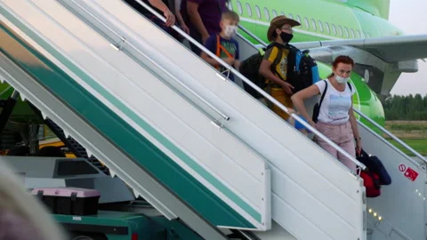 Passengers leaving the plane Stock Footage 147246487