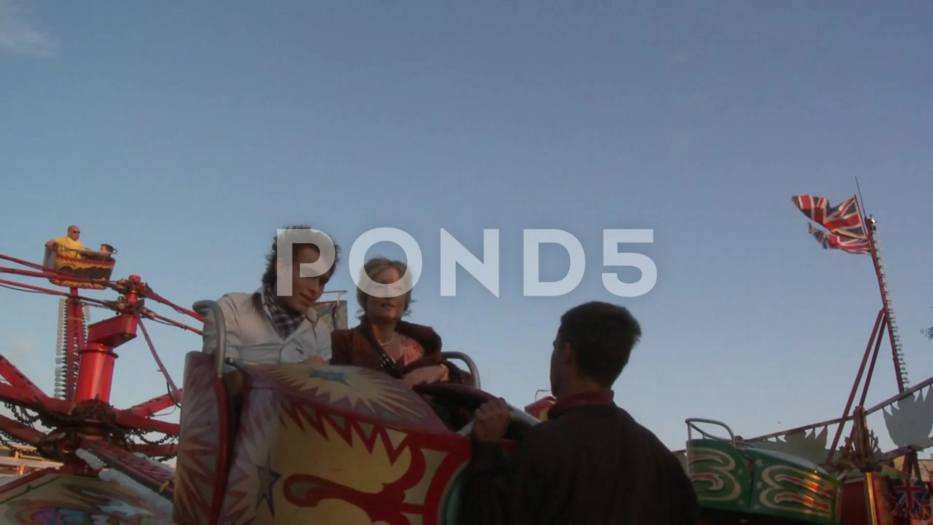 Passengers Leaving a Vintage Octopus Funfair Ride