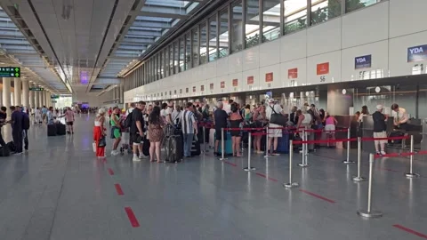 https://images.pond5.com/passengers-lined-check-counters-dalaman-footage-251643379_iconl.jpeg