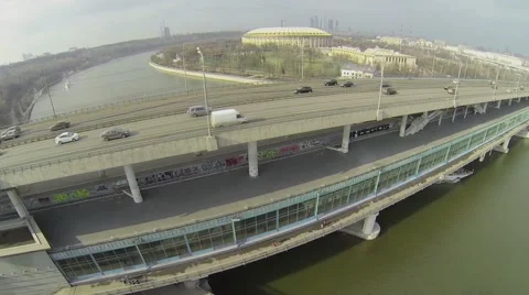 Passengers liner sails by river under metro bridge Stock Footage 40180068