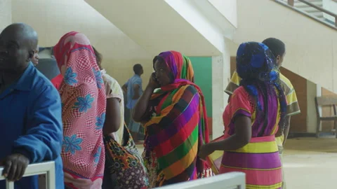 Passengers lining up to buy tickets at the train station Видео 132110826