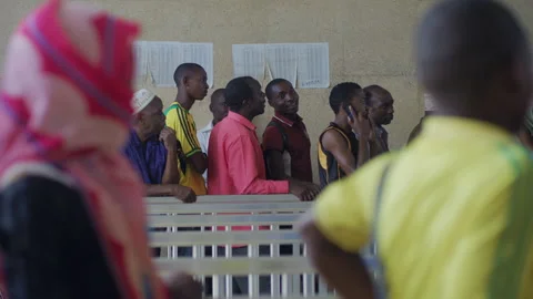 Passengers lining up to buy tickets at the train station Stock Footage 132115549