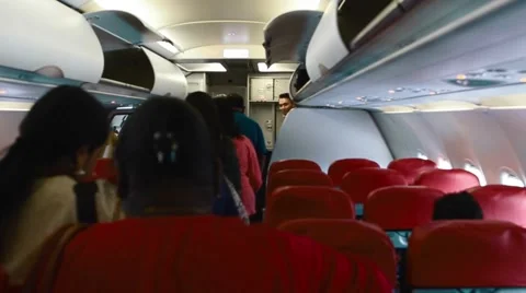 Passengers lining up to get off the airplane Stock Footage 65889510