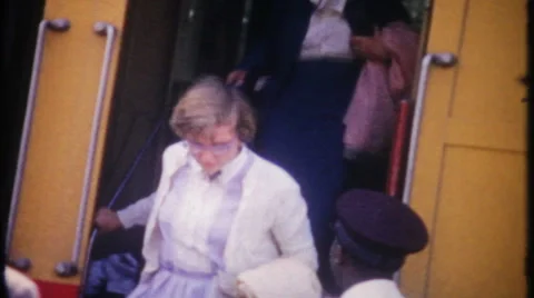 Passengers load and unload at train platform 1950s vintage film home movie 3024 Stock Footage 58512090