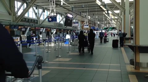 Passengers with luggage inside yvr airport Stock Footage 42203431