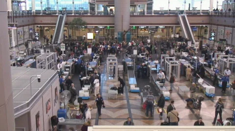 Passengers move through airport security checkpoint Stock Footage 604692