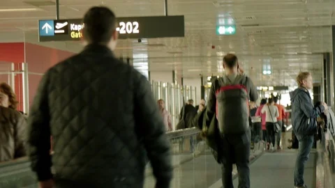 Passengers moving between Gates at Airport. Using Automatic Track. Stock Footage 89607860