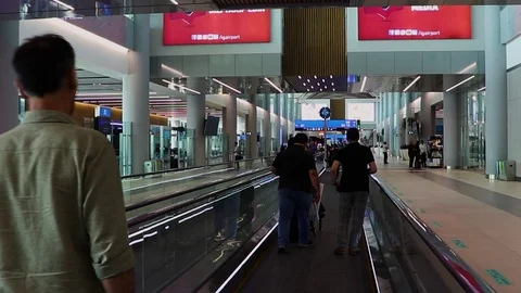 Passengers moving on the moving walkway inside the new international airport Stock Footage 117159210