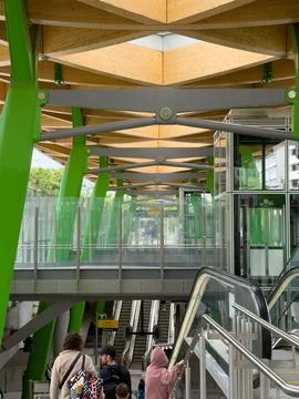 Passengers navigate the bright, modern interior of Anzac Station on Metro T.. Stock Photos