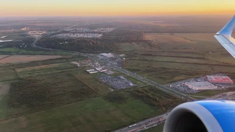 Passengers Observe Expansive Patchwork Of Rural Terrain Illuminated By Evening 스톡 동영상 336464378