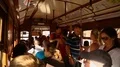 Passengers passing into middle of tramcar, public transportation service in city HD Footage