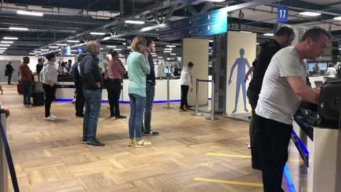 Passengers passing security check point at the Frankfurt airport Stock Footage 143125265