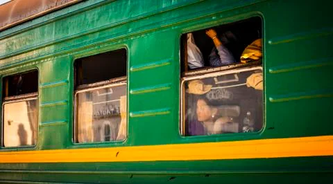 Passengers on a passing train Stock Photos