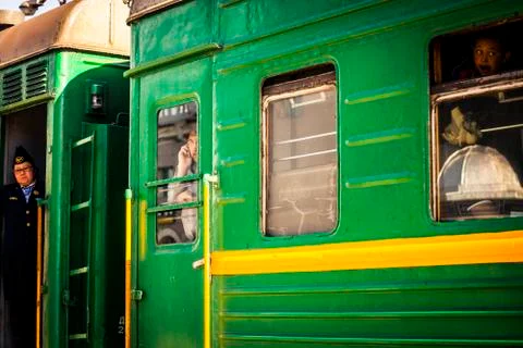 Passengers on a passing train Stock Photos