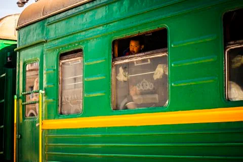 Passengers on a passing train Stock Photos