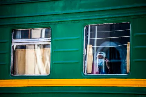 Passengers on a passing train Stock Photos