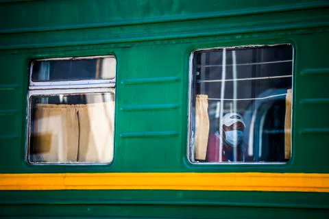 Passengers on a passing train Stock Photos