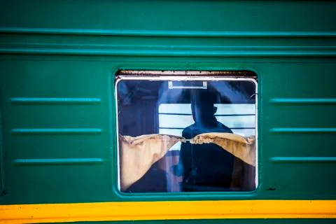 Passengers on a passing train Stock Photos