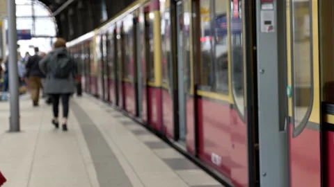 Passengers on platform and train in Berlin train station. Stock Footage 139429286