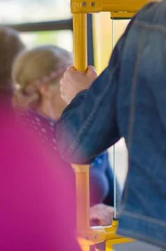 Passengers prepare for exit in interior of modern bus Stock Photos