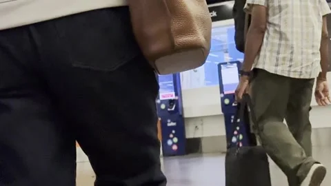 Passengers Pulling Suitcases Through International Airport Arrivals Hall Vídeo Stock 345062421