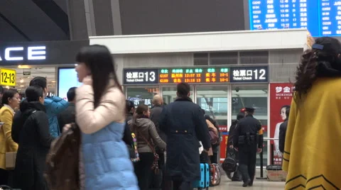 Passengers queue at Beijing South Railway Station ticket check entry gate. Stock Footage 67407481