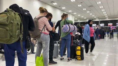Passengers queue to board a flight in Mexico City airport, Mexico 4K Stock Footage 165289003