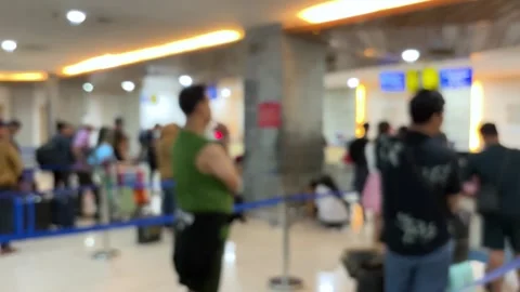Passengers queue to board a plane at the airport terminal. Video stock 320810768