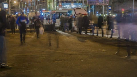 Passengers in the queue for boarding the bus on a busy street at the end of t Stock Footage 105413494