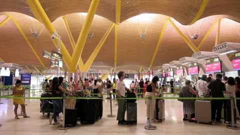 Passengers Queue at Check-In Desks, Adolfo Suárez Madrid-Barajas Departure Video stock 305146942