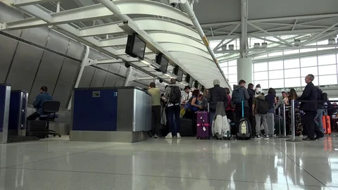 Passengers in the queue for the flight registration in Terminal 1 JFK airport. Video stock 80419424