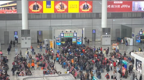 Passengers queue at gate, boarding high speed train at Hongqiao rail station. Stock Footage 67398966