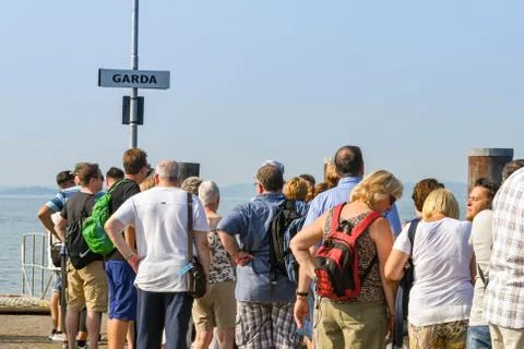 Passengers in a queue waiting for a ferry  Stock Photos