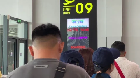 Passengers Queued In Line for Boarding at Phnom Penh Airport in Cambodia Video stock 254273171