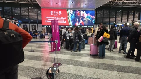 Passengers queueing at airport check-in desk Stock Footage 333569914