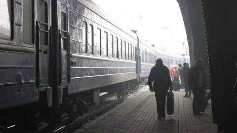 Passengers at railway station Stock Footage 83785693