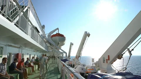 Passengers relax on the deck of a large sea ferry Stock Footage 63780532