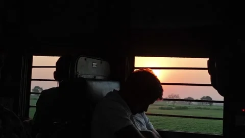 Passengers Resting Inside Train During Sunset Journey Stock Footage 323902923