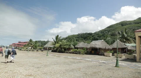 Passengers return to cruise ship as camera pans from Raiatea island to ship Video stock 68101165