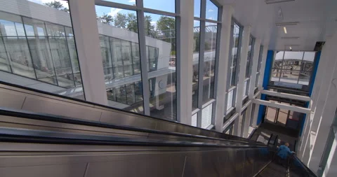 Passengers ride on the escalator down to the station of the ground metro Stock Footage 119638080