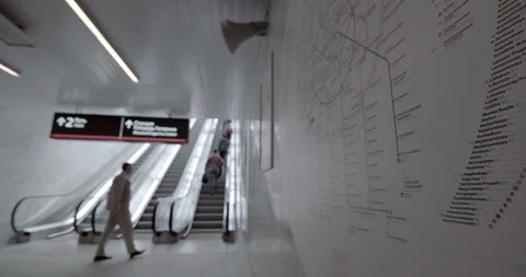 Passengers ride on the escalator up to the station of the ground metro Stock Footage 119630015