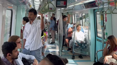 Passengers ride inside a Dubai Metro train. Dubai UAE 4 September 2026. Stock Footage 345224331