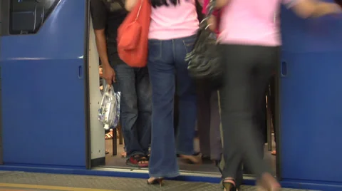 Passengers rush to catch the Skytrain at Siam Station Bangkok Stock Footage 38606894