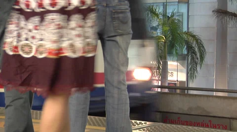 Passengers rush to catch the Skytrain at Siam Station Bangkok Stock Footage 38606940