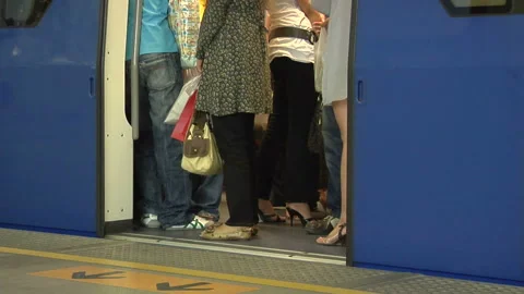 Passengers Rush to Catch the Skytrain at Siam Station, Bangkok Stock Footage 327889091