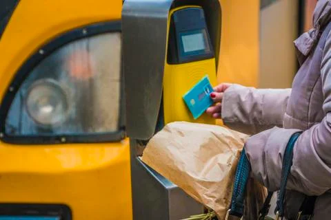 Passengers rush to the train, validate tickets, fare, public transport. Stock Photos