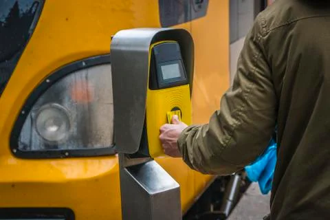 Passengers rush to the train, validate tickets, fare, public transport. Stock Photos