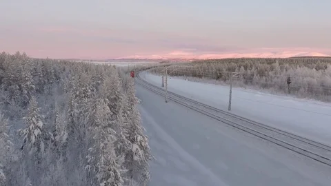 Passengers rzd Train ride in forest winter snow north. Polar night aerial 4k  Stock Footage 74503123