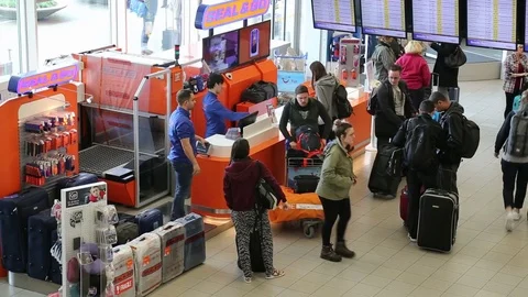 Passengers at Schiphol airport Stock Footage